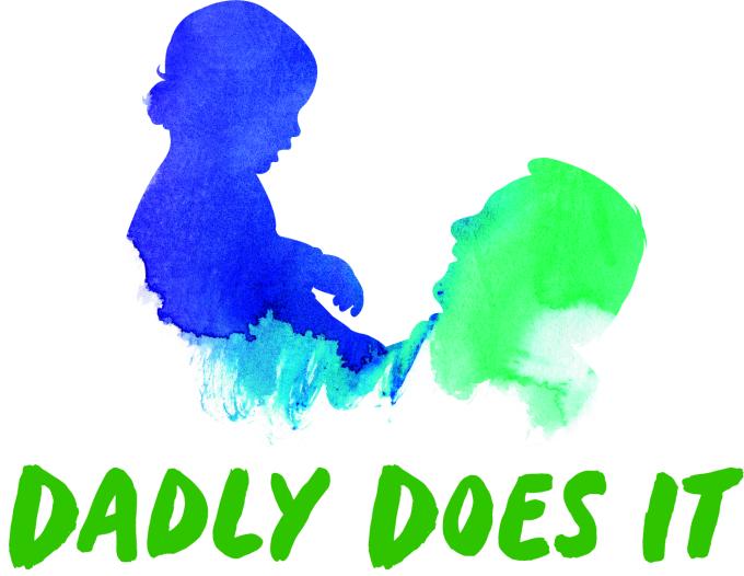 dad holding up small child with dadly does it logo
